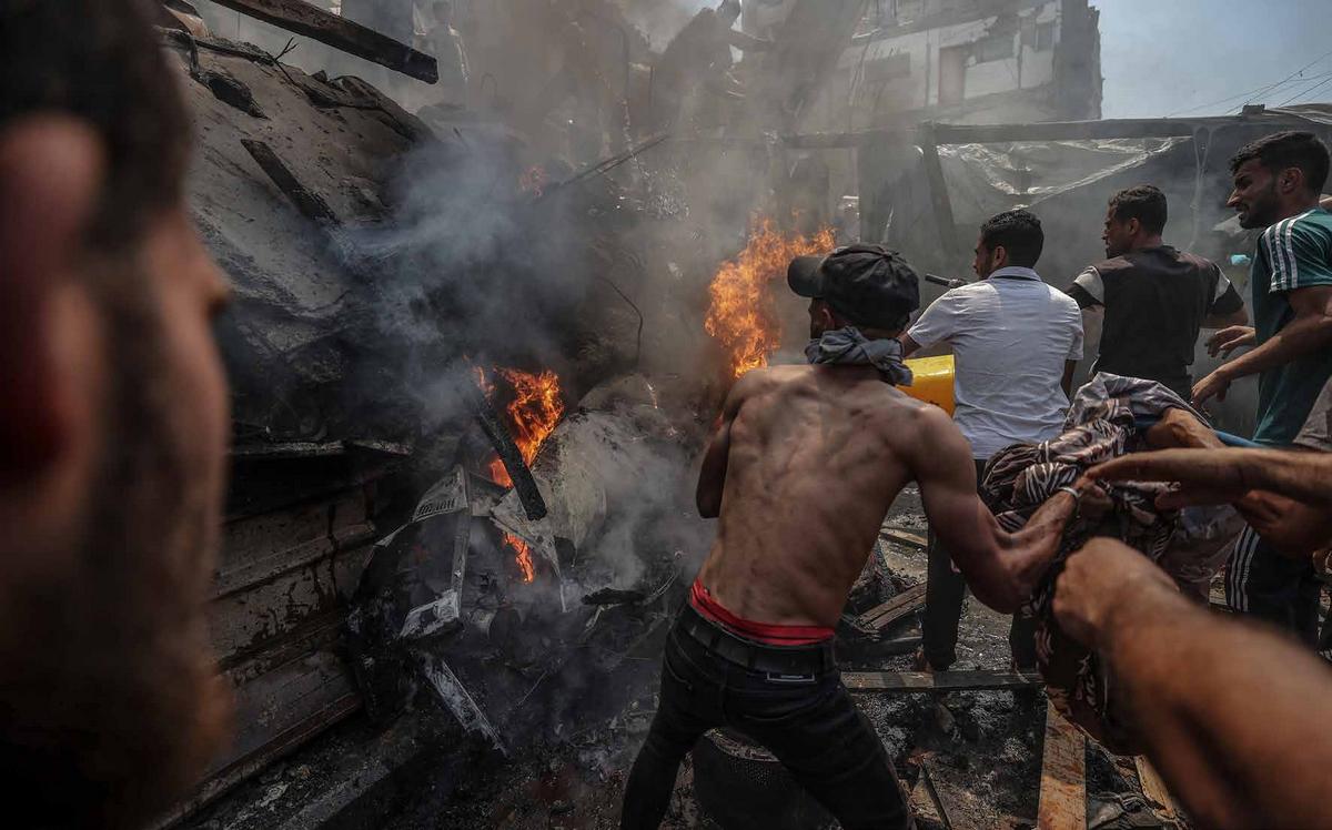 An Israeli strike on a tent used as a phone charging station in the Shati Refugee Camp in western Gaza City reportedly killed several Palestinians, including children. Residents began search and rescue efforts in the aftermath of the attack.